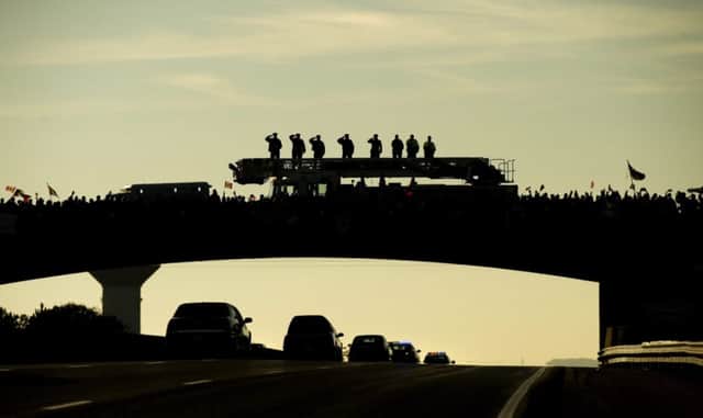 Cirillo is transported in a hearse from Ottawa to Hamilton along the Highway of Heroes in Port Hope. Picture: AP