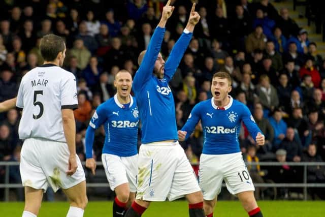 Rangers' Kris Boyd (centre) celebrates after scoring his side's third goal of the match. Picture: SNS