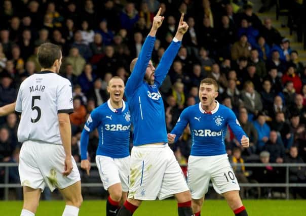 Rangers' Kris Boyd (centre) celebrates after scoring his side's third goal of the match. Picture: SNS