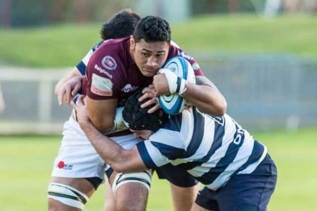 Nathan Borel and Graham Wilson tackle Galas Opeta Palepoi. Picture: Ian Georgeson