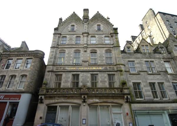 Police searched the old Scotsman building at 30 Cockburn Street. Picture: TSPL