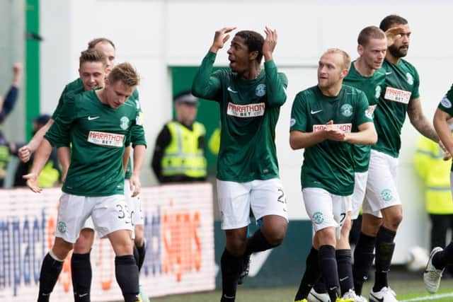 Goalscorer Dominique Malonga (centre) leads the Hibernian celebrations. Picture: SNS