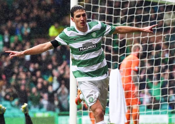 Celtic's Stefan Scepovic celebrates after scoring his side's second goal of the game. Picture: SNS