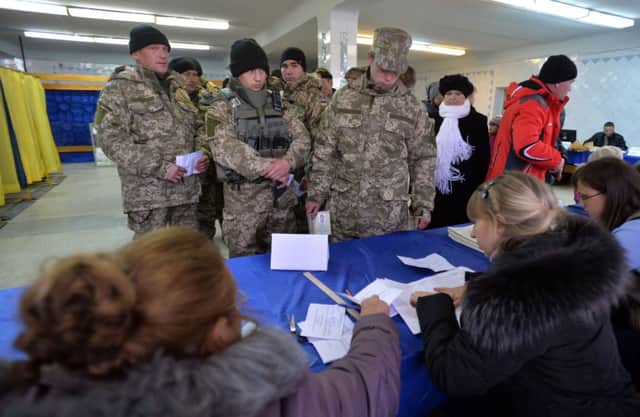 A group of soldiers vote at a polling station in Kramatorsk. Picture: AFP