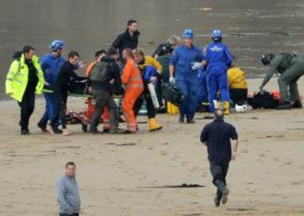 Rescue services battle to save the lives of the surfers. Picture: Newsteam