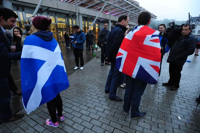 Yes and Union supporters are interviewed outside the Scottish parliament. Picture: Ian Rutherford