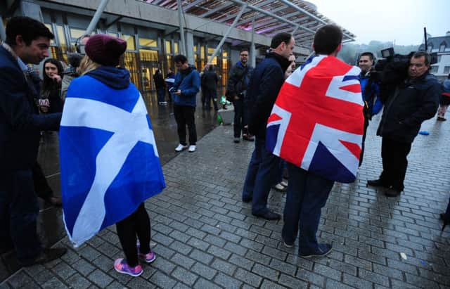 Yes and Union supporters are interviewed outside the Scottish parliament. Picture: Ian Rutherford