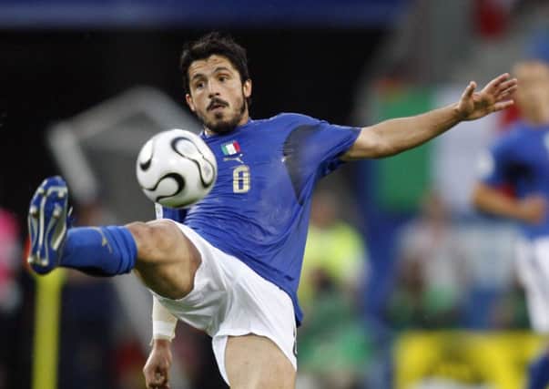 Gennaro Gattuso, pictured playing for Italy, has decided to stay on as coach. Picture: Getty