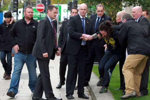 The man is arrested after apparently colliding with the Prime Minister. Picture: SWNS/Ross Parry