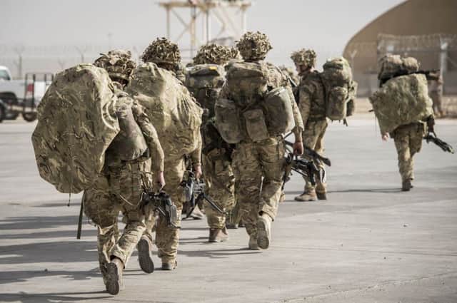 Heading for home, British troops turn their backs on the Afghan conflict. Picture: PA