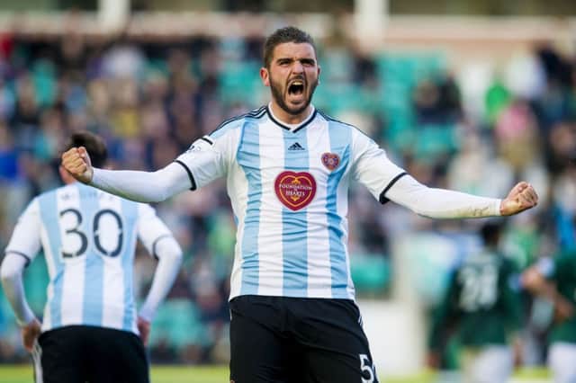 Alim Ozturk celebrates after grabbing a late equaliser for Hearts. Picture: SNS