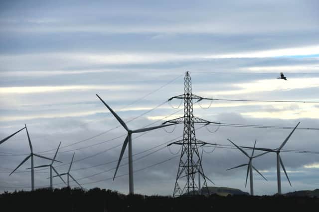Wind turbines stand close by Mossmorran Ethleyne Plant. Picture: Getty
