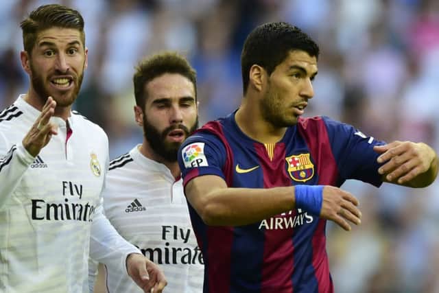 Sergio Ramos, left, is on the 23-man list but Luis Suarez misses out. Picture: Getty