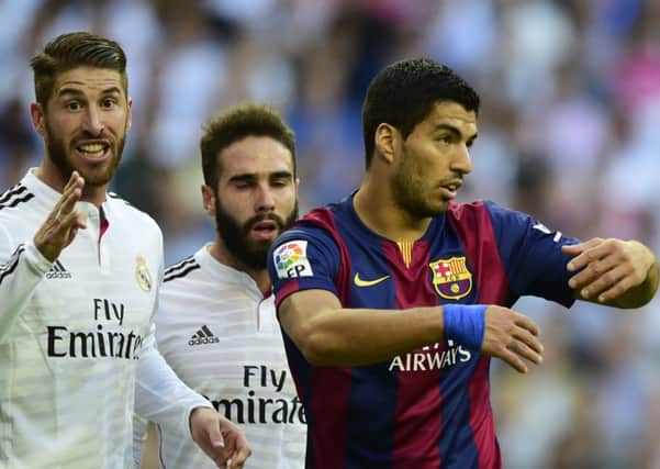 Sergio Ramos, left, is on the 23-man list but Luis Suarez misses out. Picture: Getty