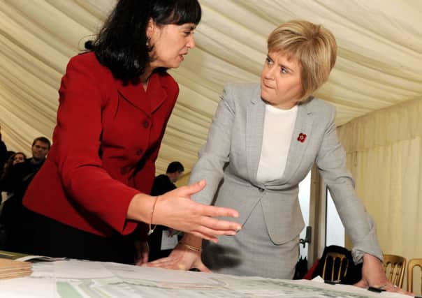 First Minister Nicola Sturgeon looks over the construction plans with Safia Qureshi (National Centre Project Director). Picture: TSPL