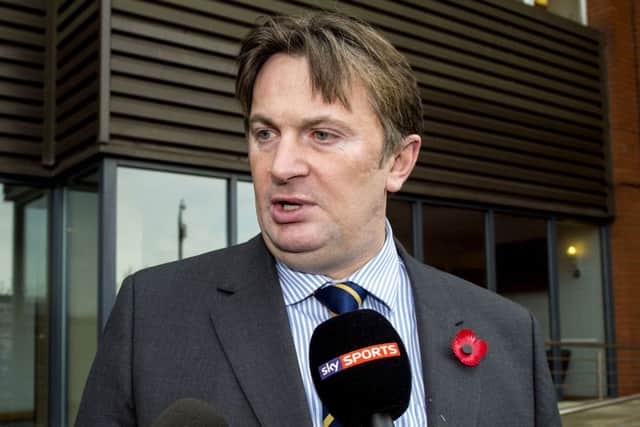 Sandy Easdale is mobbed by the press as he leaves Ibrox. Picture: SNS