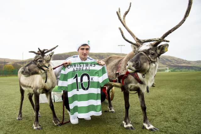 Stefan Scepovic helps publicise the Celtic FC Foundation's donation to its Christmas Appeak. Picture: SNS