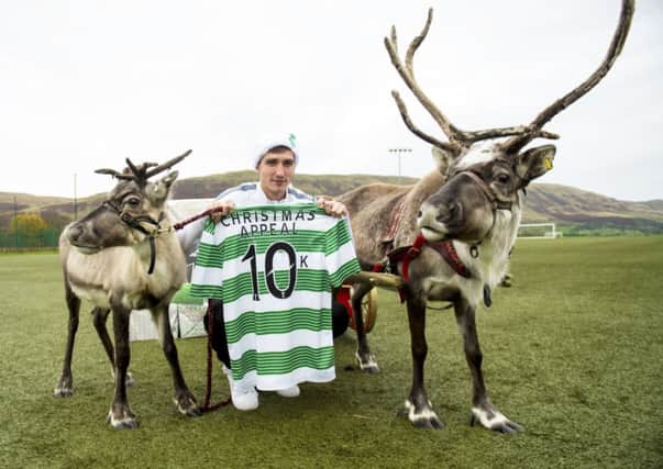 Stefan Scepovic helps publicise the Celtic FC Foundation's donation to its Christmas Appeak. Picture: SNS