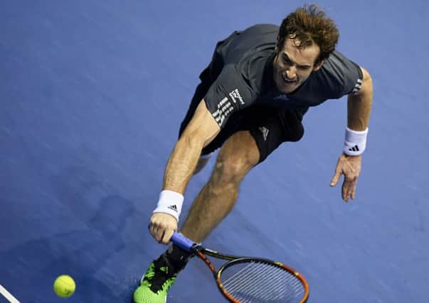 Andy Murray stretches for a ball against Tommy Robredo of Spain during their Valencia Open final. Picture: Getty