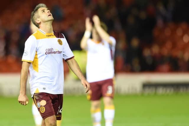 Dejection for Motherwell's Keith Lasley following loss to Aberdeen. Picture: SNS