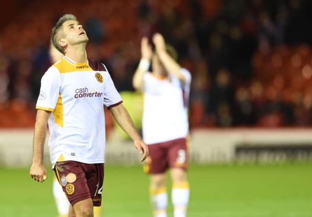 Dejection for Motherwell's Keith Lasley following loss to Aberdeen. Picture: SNS