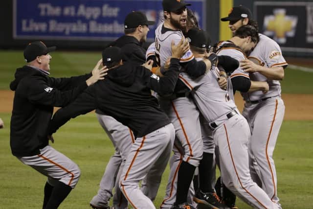 Jubilant San Francisco Giants players mob pitcher Madison Bumgarner. Picture: AP