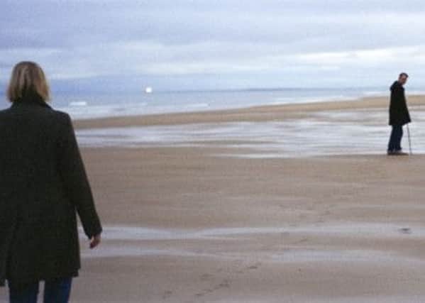 Grace Maxwell follows Collins along the beach. Picture: Contributed