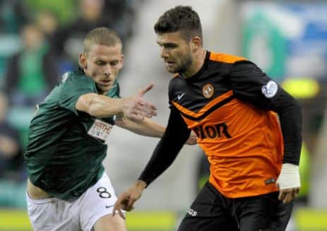 Scott Robertson chases Dundee Uniteds Nadir Ciftci in the League Cup tie at Easter Road. Picture: Jane Barlow