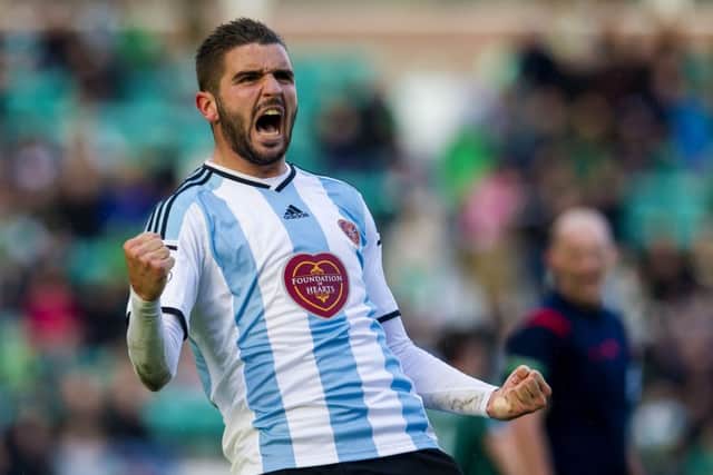 Alim Ozturk celebrates after scoring for Hearts. Picture: SNS