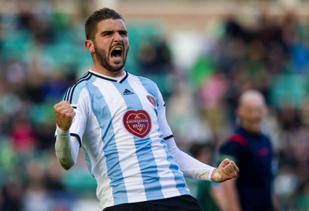 Alim Ozturk celebrates after scoring for Hearts. Picture: SNS
