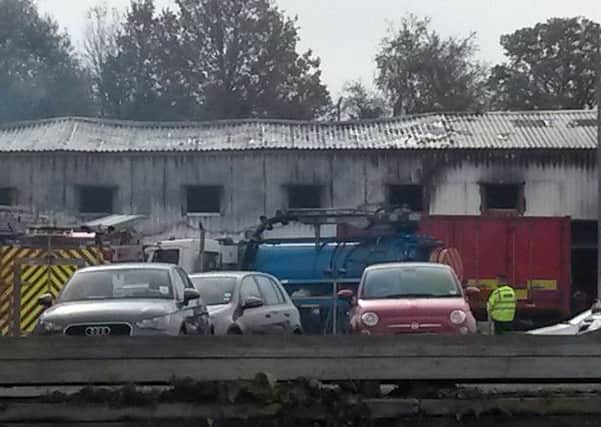 Smoke at the scene of a fire at a fireworks factory in Stafford, as rescue workers planned to begin their search for the missing people. Picture: PA