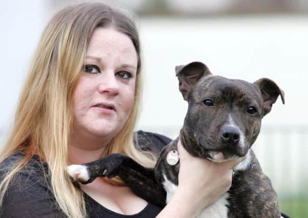 Anna Straube was reunited with dog Roxi. Picture: Peter Jolly