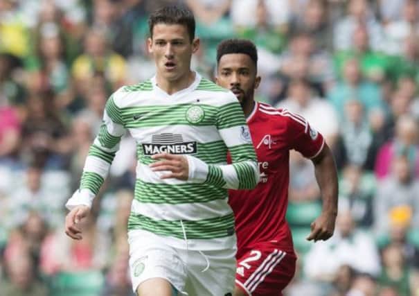 Aleksandar Tonev, with Shay Logan in close attention during the Scottish Premiership match in September. Picture: SNS