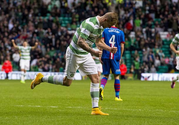 Celtic star John Guidetti charges off to celebrate his opener. Picture: SNS