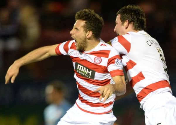 Hamilton striker Tony Andreu (left) celebrates his late equaliser. Picture: SNS
