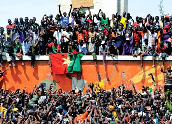Burkina Faso citizens celebrate the ousting of president Blaise Compaoré. Picture: Getty