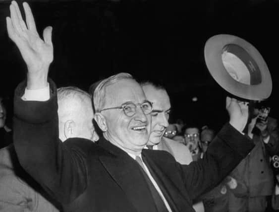 Harry S Truman raised his arms in triumph when he learned he had been elected president of the USA. Picture: Getty