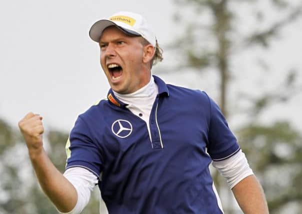 Marcel Siem celebrates after chipping in at the first play-off hole. Picture: AP