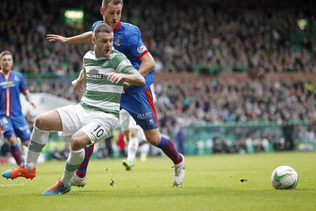 Anthony Stokes holds off Gary Warren as Celtic and Inverness CT meet on Scottish Premiership duty. Picture: PA