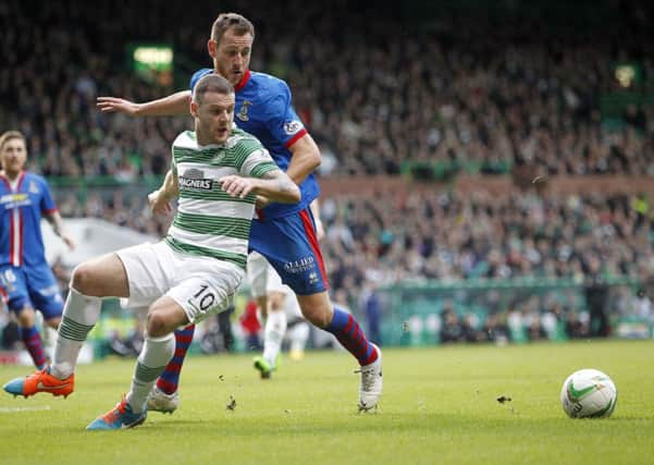 Anthony Stokes holds off Gary Warren as Celtic and Inverness CT meet on Scottish Premiership duty. Picture: PA