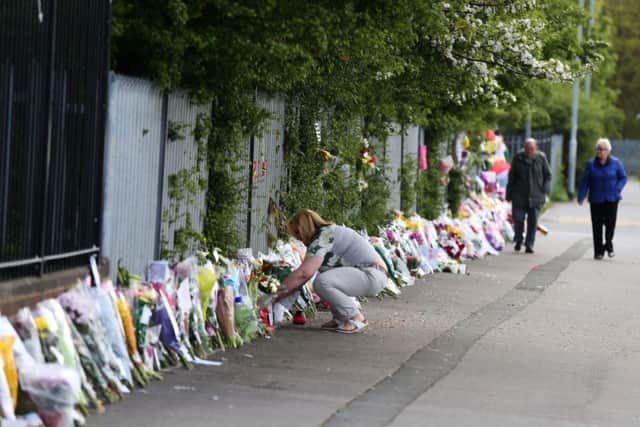 Tributes for Ann Maguire outside Corpus Christi School, Leeds. Picture: PA