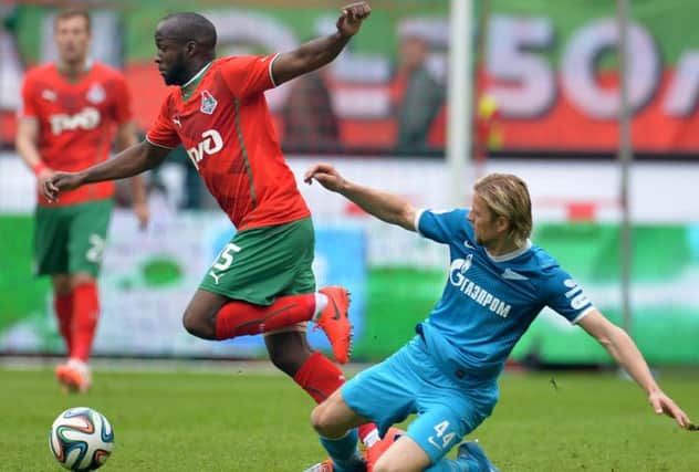Lassana Diarra gets away from Zenit's Anatoliy Tymoshchuk during a Russian Premier League match in May. Picture: Getty