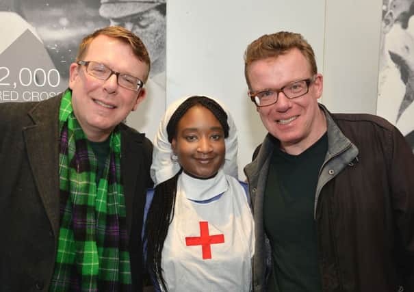 Charlie, left, and Craig Reid of the Proclaimers with Red Cross  nurse Angelina Martins during the launch of All Together Now. Picture: PA