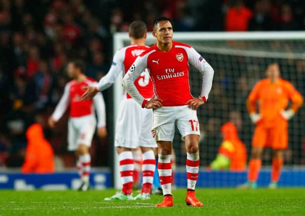 Despair for Alexis Sanchez of Arsenal as Aleksandar Mitrovic of Anderlecht (not pictured) scores their third goal. Picture: Getty