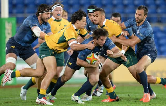 Argentina centre Marcelo Bosch tries to break free during his sides away match against Australia. Picture: Picture: Getty