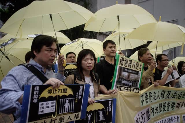 Democracy campaigners march over arrests in mainland China. Picture: Philippe Lopez/AFP/Getty Images