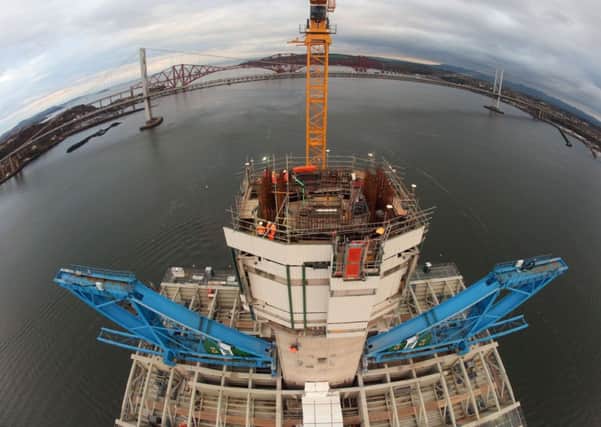 Construction crews work on the central tower located on Beamer Rock in the Forth, Scotland, as work continues on the Queensferry Crossing. Picture: PA