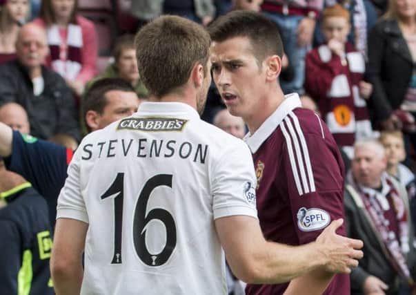 Two players from Edinburgh derby rivals Hibernian and Hearts have an altercation. Picture: SNS