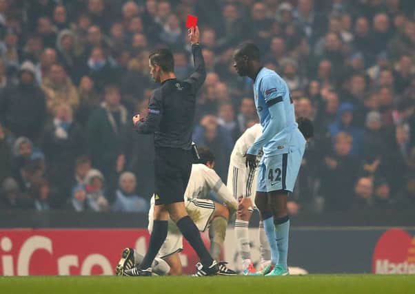 Yaya Toure of Manchester City is shown a red card by Referee Tasos Sidriopoulos. Picture: Getty