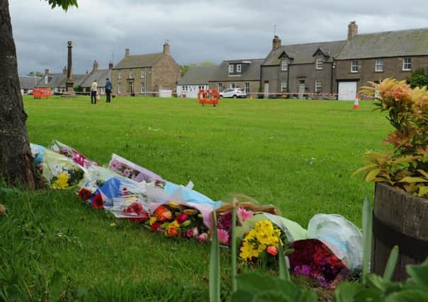 Floral tributes following the death of three spectators during the Jim Clark Rally. Picture: JP